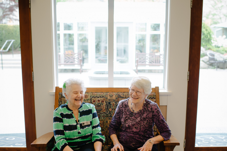 Two ladies sitting on bench